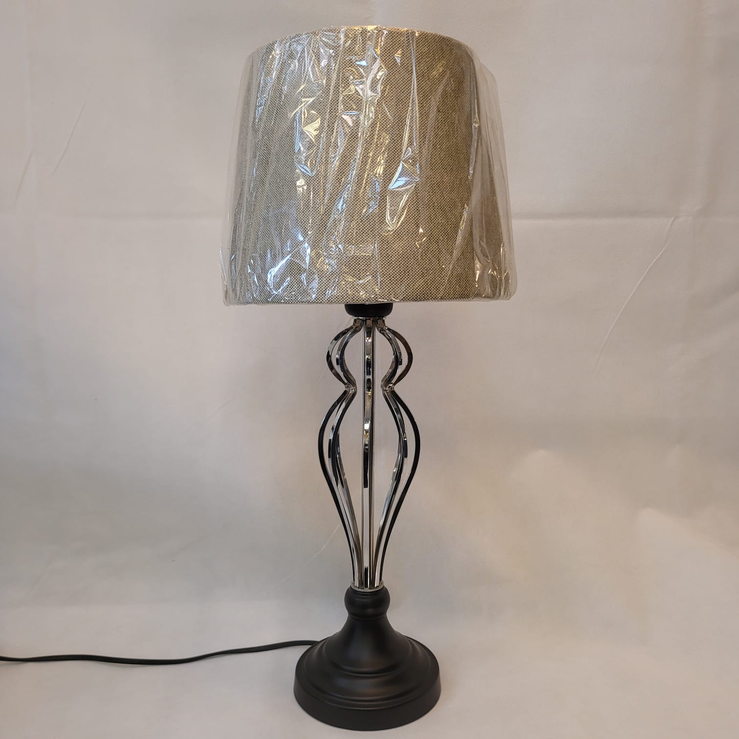 Modern Curved Metal Table Lamp with Beige Shade